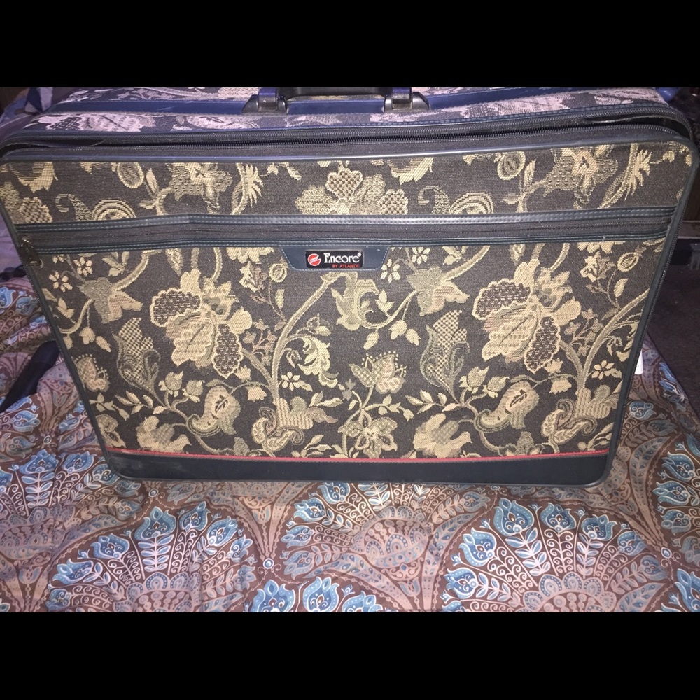 Two Encore suit cases